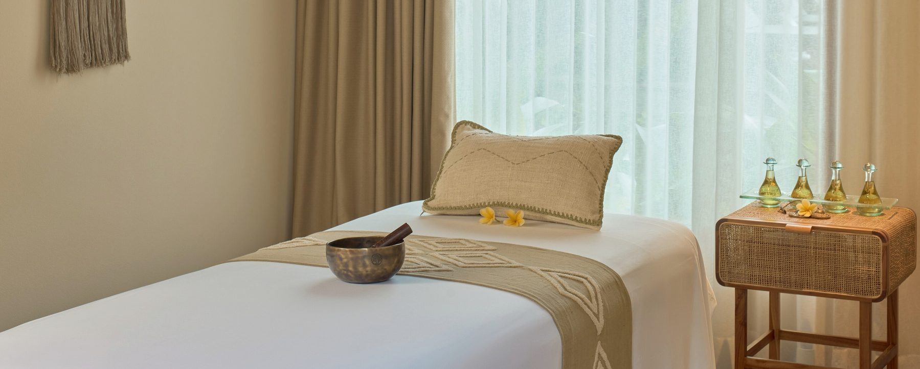 Timber joinery, mirror and folded linen in the treatment room